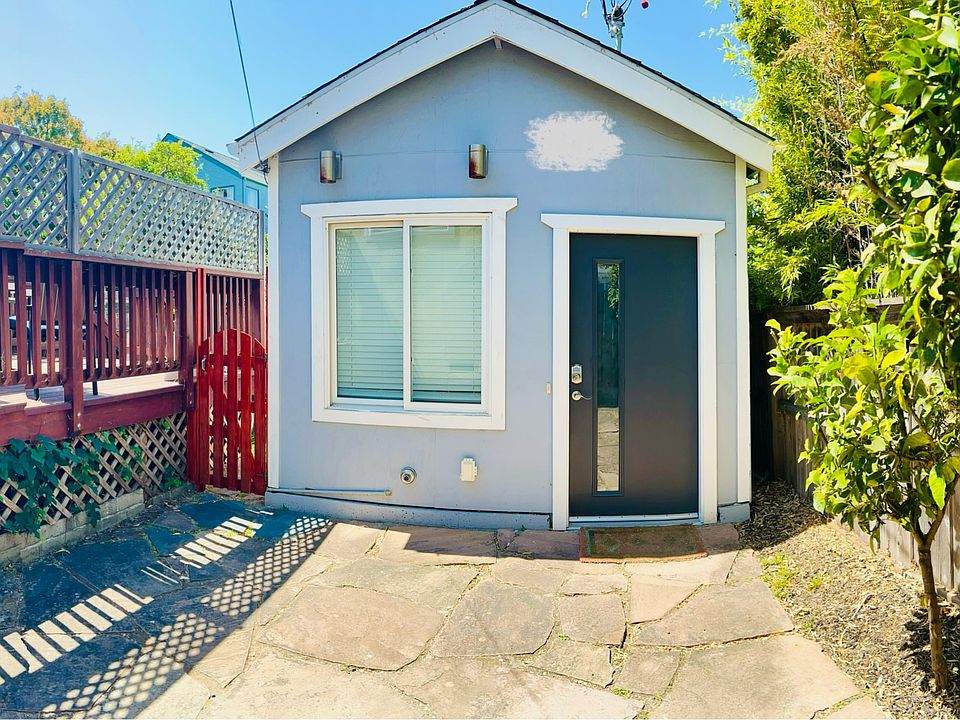 Welcome Home!
Front view of cottage, private courtyard upfront with lemon tree