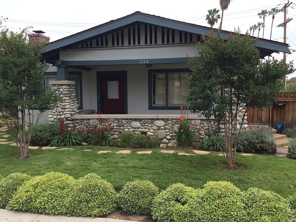 Beautiful large porch with Arroyo Seco river rocks.