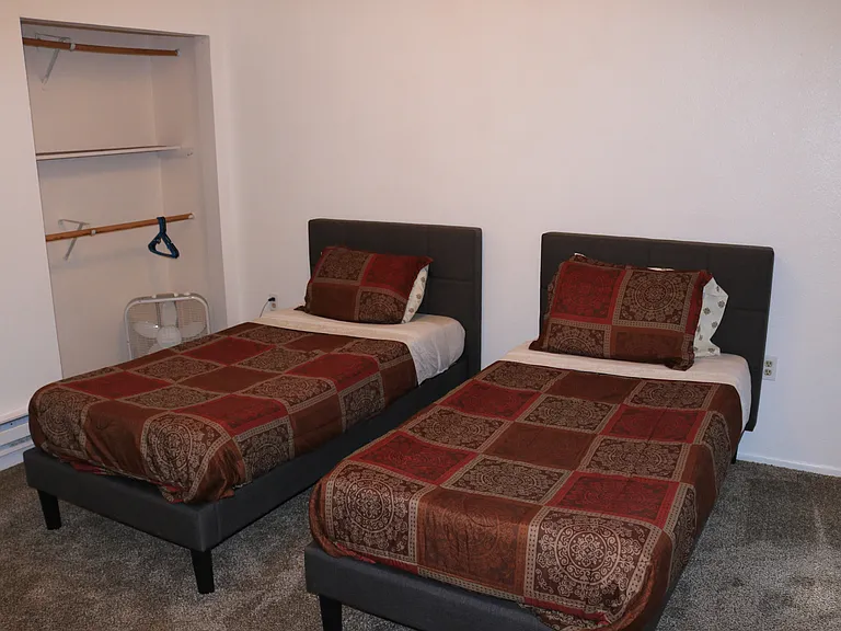 second bedroom has two single beds with memory foam