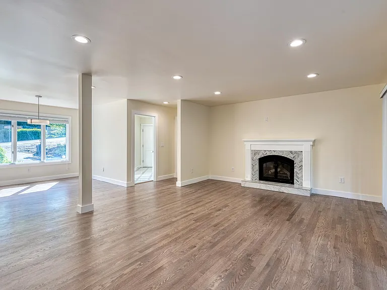 Main living room with dining area and laundry room close by