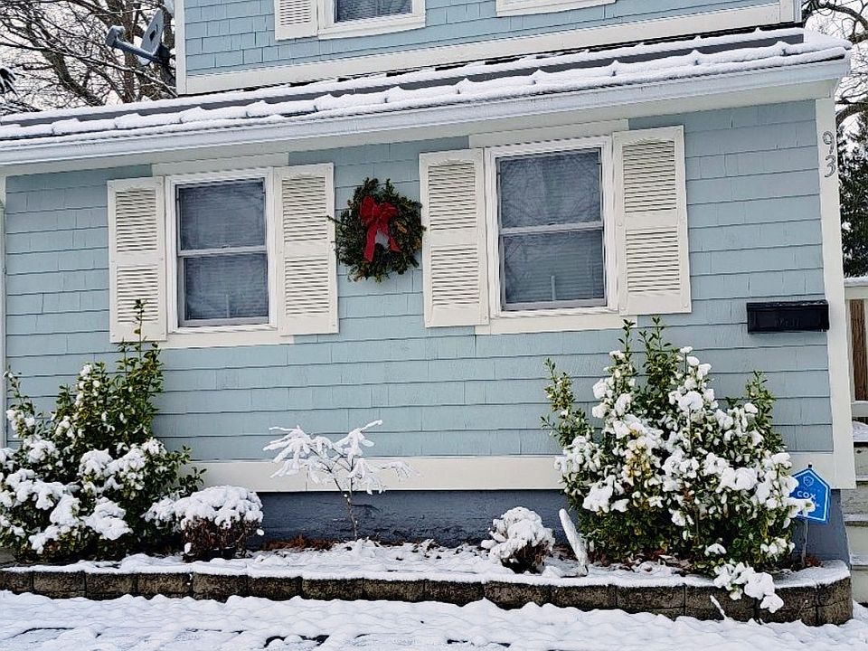 Bright, sunny cottage on a snowy winter day (front of house)