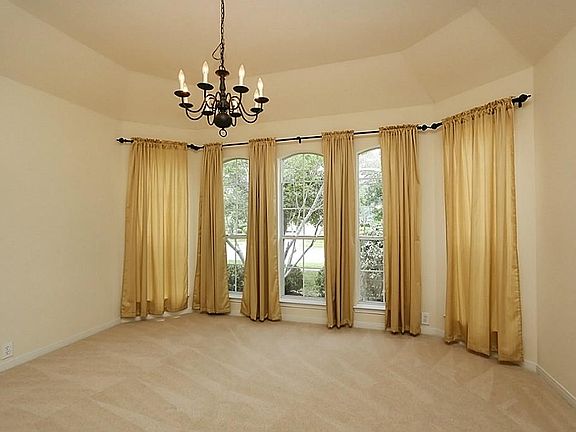 Formal dining with great overview of front yard!