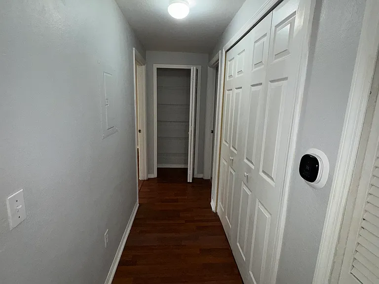 Hallway, Laundry area, AC unit.