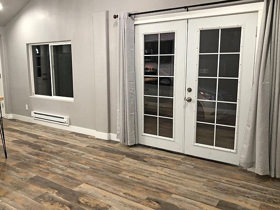 French doors and vaulted ceiling in main living area