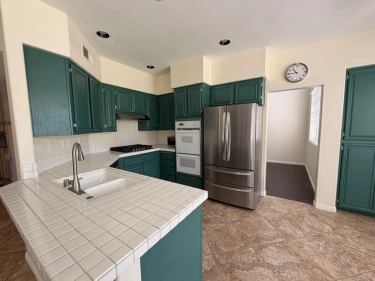 Kitchen - comes with fridge, double wall oven, stove top, microwave, and dishwasher.