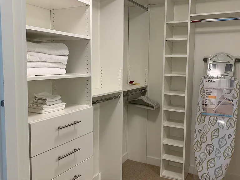 Walk in with custom closet organizers