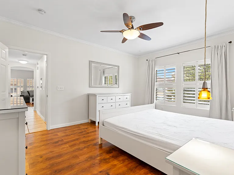 King size bed with dual night stands, large walk in closet, and 2 large dressers for additional storage