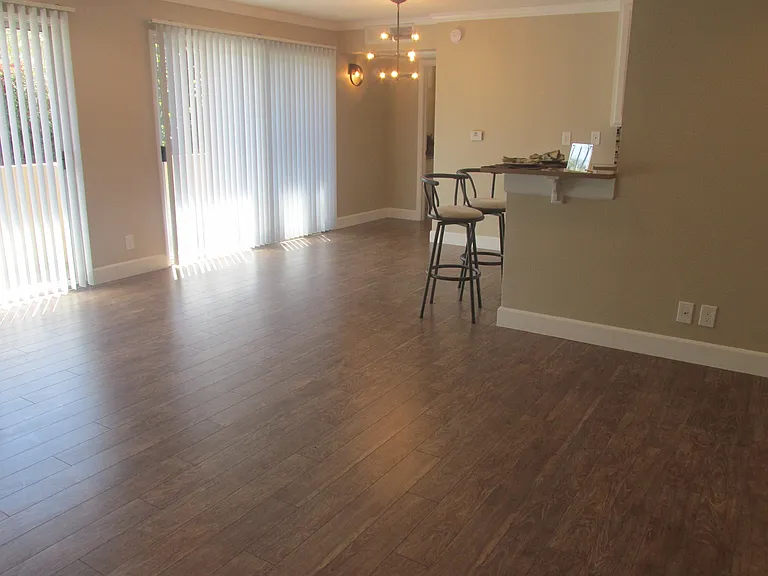Spacious living room and a den at the Azure, a 1br/1ba apartment with a den and 4 balconies allowing lots of natural light in
