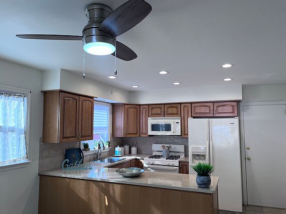 Natural light pours into the apartment and rear door accesses backyard