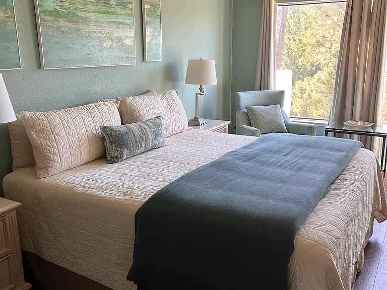 Master Bedroom suite with views of the Monterey pines with full wall large closet. Electric fireplace for cozy nights.