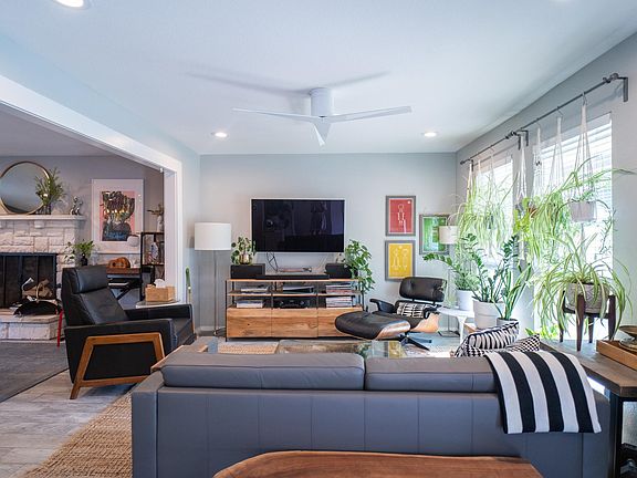 Open concept floor plan, modern finishes, and luxury touches, like the sleek ceiling fan.