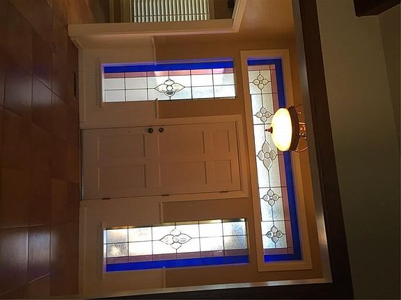 Large foyer with beautiful stained glass windows.