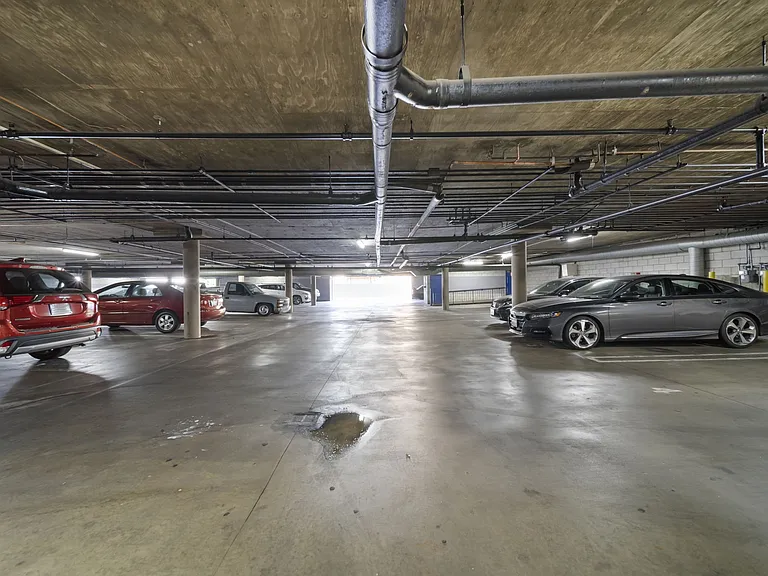Secure, gated parking garage offering ample covered parking for resident convenience.