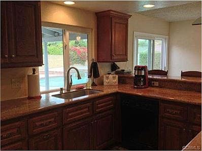 While you are washing dishes in the stainless sink, you have a b