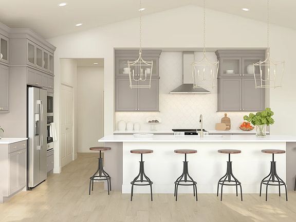 Kitchen with pendant lighting and glass upper cabinets