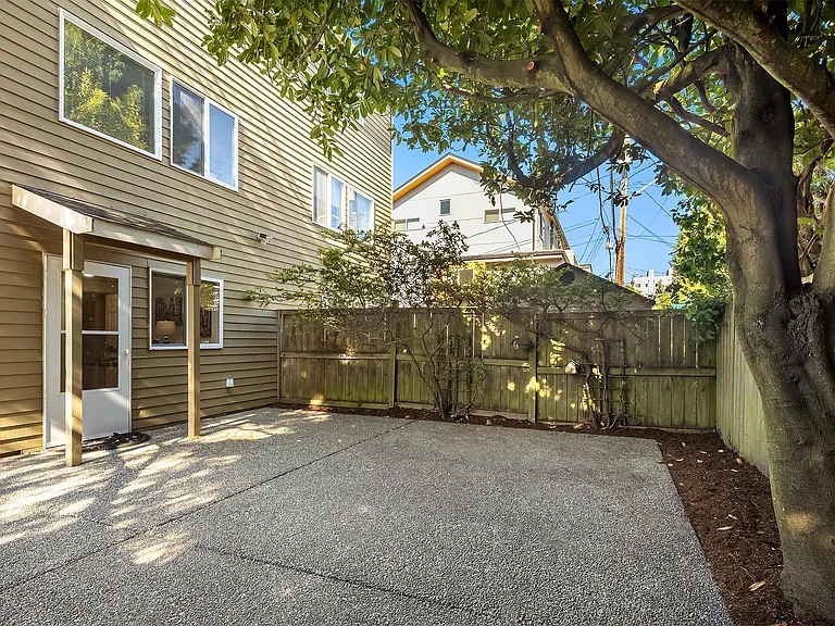Large parking pad that also offer space for outdoor grilling and private seating area.