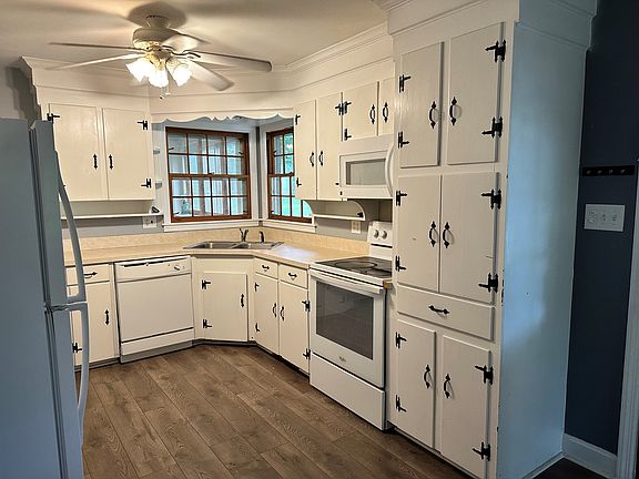 Enter the kitchen through the carport