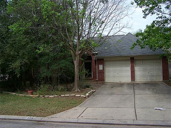 Two car garage with storage area.