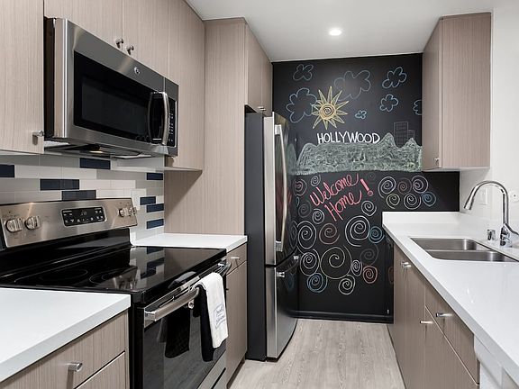 Design Package III Kitchen with hard surface flooring stainless steel appliances