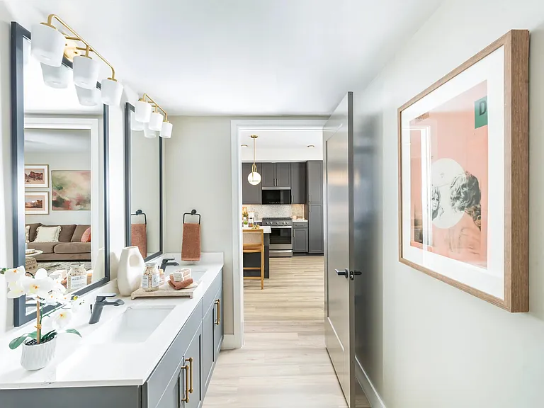 Modern vanities with designer lighting and elevated finishes bring style and function to your daily routine.
