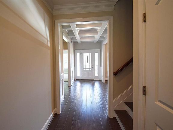 Front door entrance with coffered ceiling