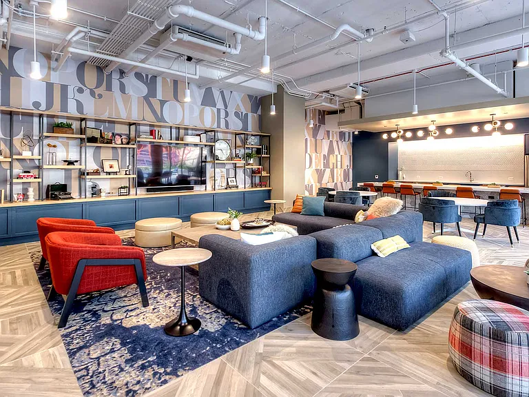 Our residential lounge features era-inspired details including millwork and custom graphics designed with the inner-workings of a print shop in mind.