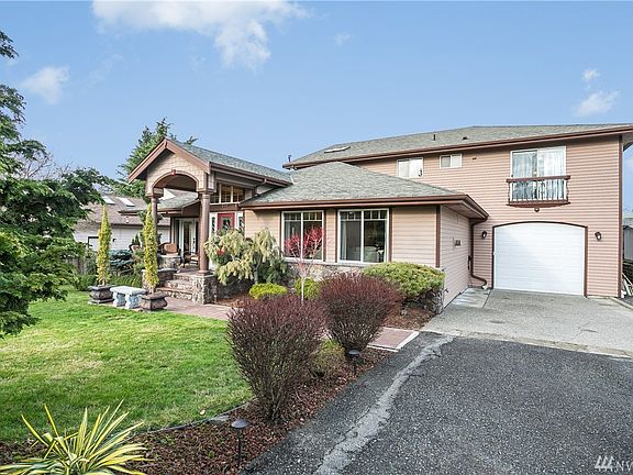 Large driveway offers plenty of off-street parking and leads to the enormous 4-car garage. Bring the boat and RV with room for a