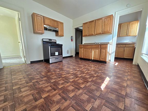 Charming kitchen with a butler's pantry and plenty of cabinet space, offering a comfortable area for everyday cooking and dining