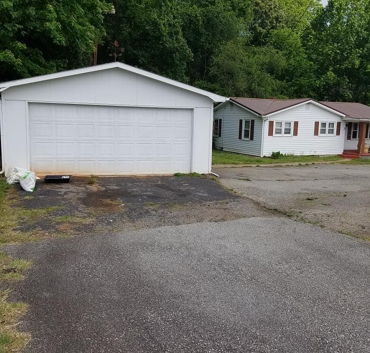 Garage/work shop with house in background