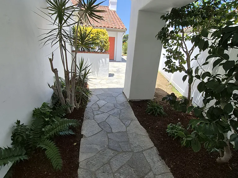 New gate with flagstone walkway. Gate can be locked for more security and privacy.