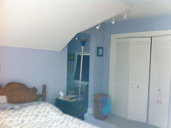 master bedroom with sitting porch looking toward the water and Portland