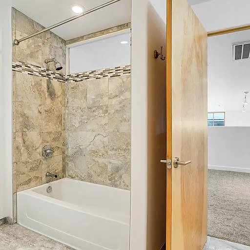 Upstairs tub and shower at 3202 "The Edward" Loft is as big as the downstair tub and shower!