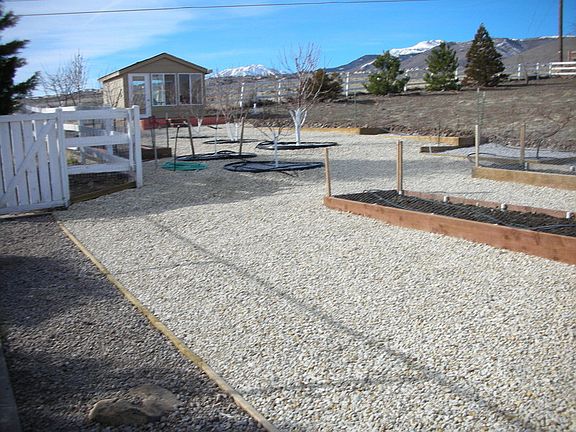 Back
						:
						Studio adjacent to forever wild public land, fruits, grapes, half-acre vacant.