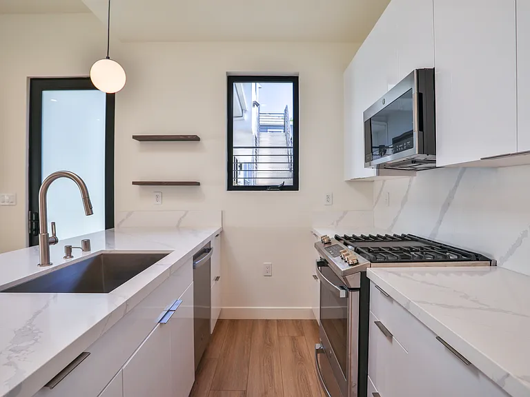 Kitchen featuring stainless steel GE appliances