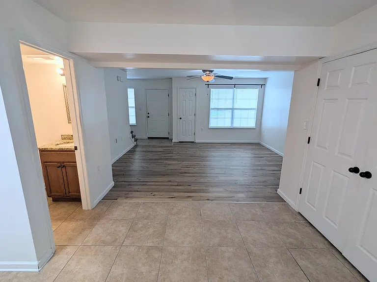 Half bathroom, laundry closet, looking into living room