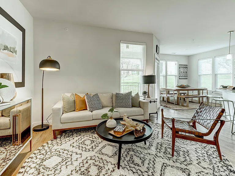 Living room with wood inspired flooring throughout