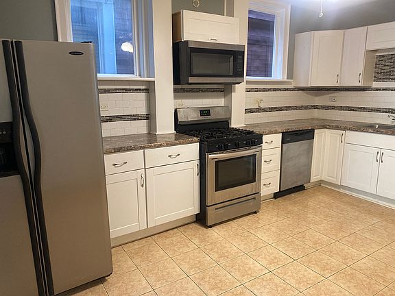 Large Kitchen With Natural Lighting and Ceiling Fan
