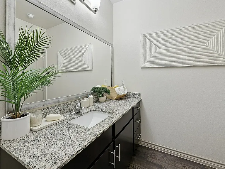 Spacious bathroom with large mirror and lots of counter space