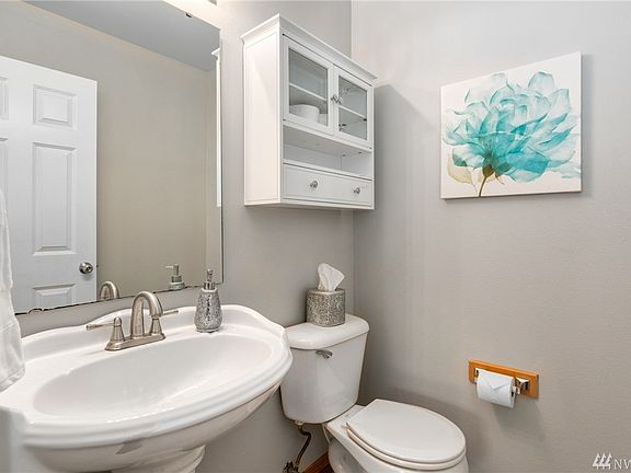 Main level powder room for your guests.