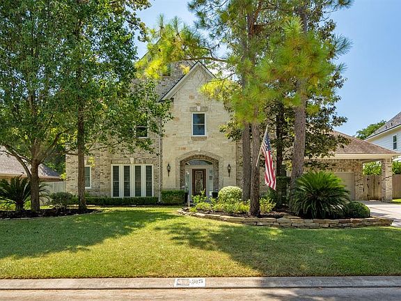 Handsome timeless elevation features brick and stone in neutral tones. Very recently the sellers have added new replacement wind