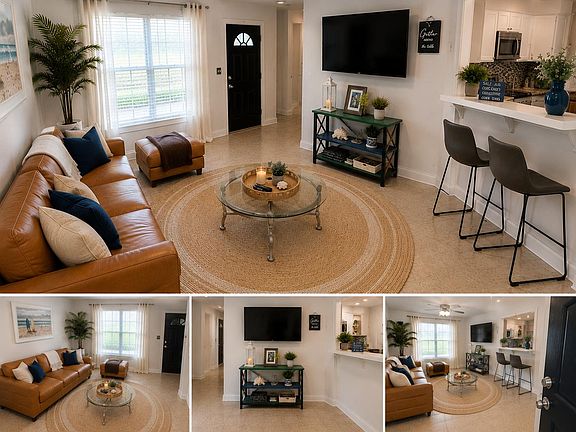 Open living area with large window, seating space, and a breakfast bar that connects to the kitchen for easy dining.