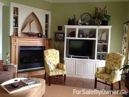 Living Room Area
						:
						Built in entertainment center and fireplace with gas logs for your comfort.