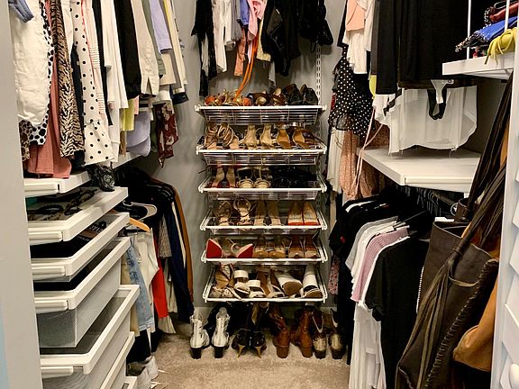 walk-in closet of master bedroom