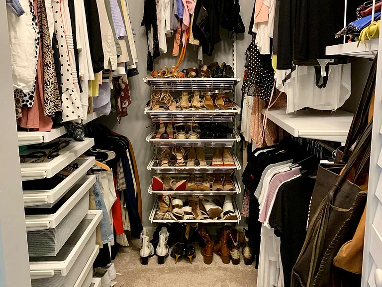 walk-in closet of master bedroom