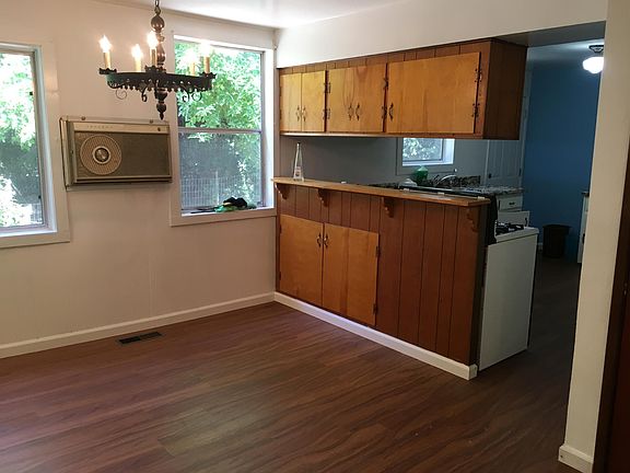 Half of the large dining room. Sorry, vintage A/C is a conversation piece only, but unit stays quite cool during the summer.