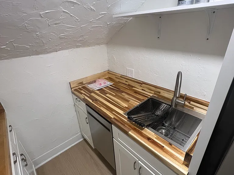 Newly remodeled kitchen w/ new refrigerator and dishwasher. A new venting skylight with shade was installed and also has electric stove.