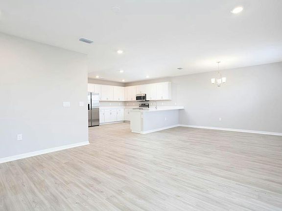 This spacious home features a sunny, open-concept main living area - Wayfair III by Highland Homes