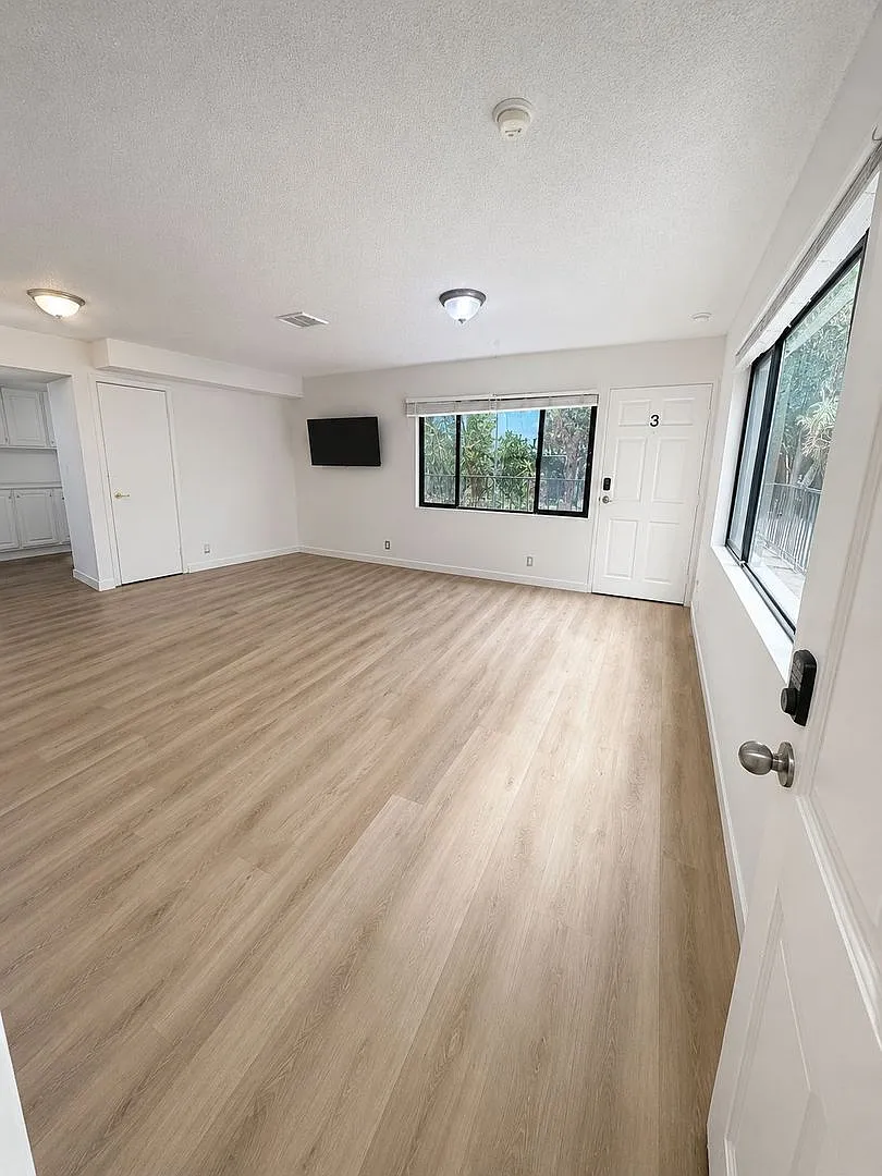 A fully furnished 3 bedroom, 2 bathroom apartment with common areas at 1823 Pelham Ave. Unit 3 — Photo 1