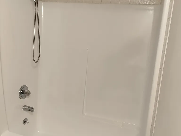 Tub and walls refinished May 1st.