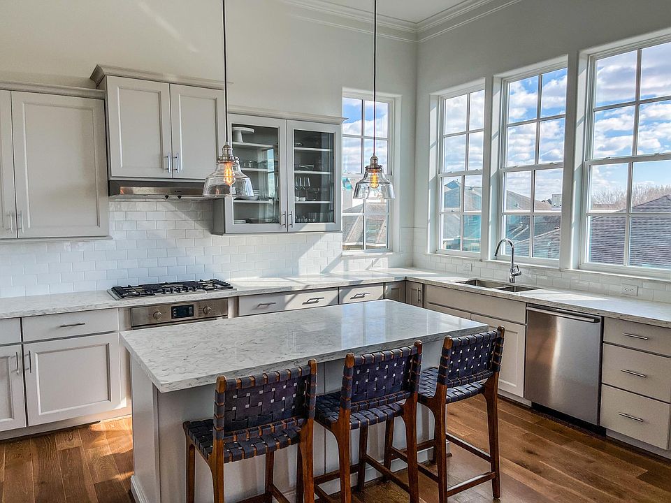 Dreamy natural lighting floods through the windows in the kitchen.